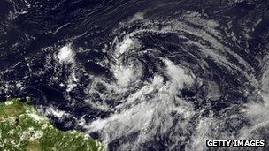 Tropical Storm Isaac forms in the Caribbean satellite image provided by National Oceanic and Atmospheric Administration