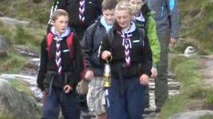 Scouts carrying miner's lamp