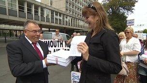 Airport petition handed to council leader Tudor Evans