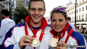 Sam Hynd and Liz Johnson with the Olympic medals they won in Bejing in 2008