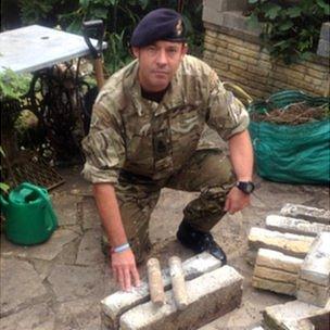 Petty Officer Sid Laurence with the devices