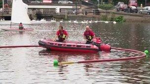 Firefighters taking part in a mock river rescue