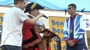 Mayor Nick Webb presents Anthony Ogogo with the coat of arms