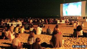 A film being shown on a beach on the Riviera Romagnola