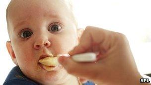 Baby being fed