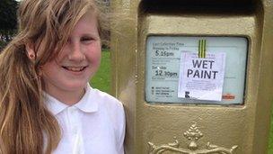 Schoolgirl at second gold post box