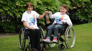 Maggie McEleny and Jodie Taylor with Paralympic flame