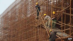 File photo: Labourers at a construction site in China