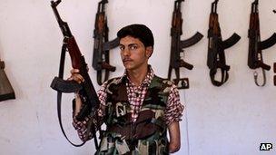 Syrian rebel fighter Ali Alnajjr, 20, a former school student, poses for a picture.