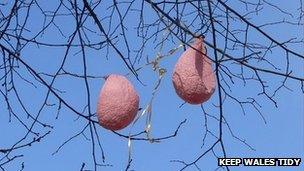 Deflated balloons in a tree