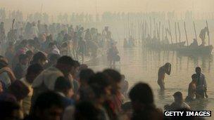 Hindu pilgrims gather to bathe at sunrise during the Ardh Kumbh Mela festival. File photo