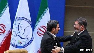 Mahmoud Ahmadinejad (left) and Mohammed Morsi