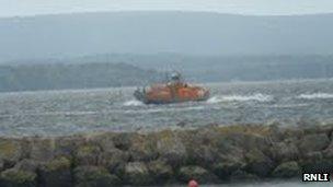 Poole RNLI all-weather lifeboat searching for the family