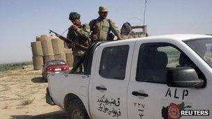 Members of the Afghan Local Police (ALP) patrol at the Char Darah district of Kunduz province