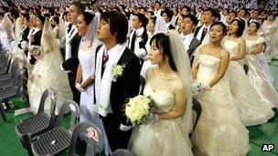 Mass wedding ceremony arranged by the Unification Church in Cheonan, South Korea, in August 2005