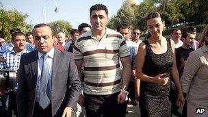 Ramil Safarov, centre, walks in the Martyrs' Alley national memorial in Baku. 31 Aug 2012