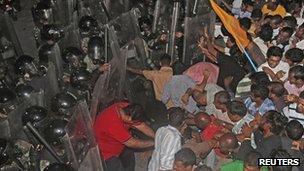 Supporters of former Maldivian President Mohamed Nasheed clash with soldiers during a protest in Male on 1 September