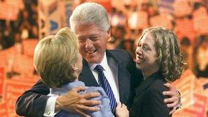 Bill Clinton with his wife Hillary (L) and daughter Chelsea