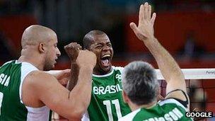 The Brazil's sitting volleyball team celebrate a point