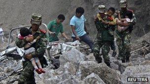 Chinese soldiers rescue children in Zhaotong, Yunnan province