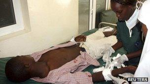 Nurses attend to a victim of the Tana river clashes between the pastoralists and farmers within the Tana river delta, at the Malindi District hospital, 7 September 2012