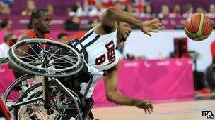 USA's Trevon Jenifer falls from his wheelchair during the men's wheelchair basketball bronze medal match