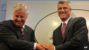 Kosovo Prime Minister Hashim Thaci, (r) handshakes with International Civilian Representative, Pieter Feith