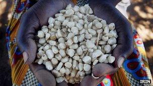 Woman holding some beans