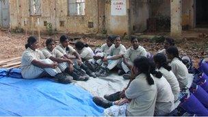 Female mine clearers in Sri Lanka take a break from work