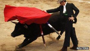 A young bullfighter takes part in the Under-14 Apprentice Bullfighting Competition" in the Arroyo bullring, Mexico City, 8 September 2012