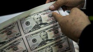 A sheet of counterfeit fifty US dollar bills