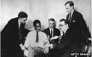 James A Frye, who is on trial for murder, undergoing a truth test which is administered by William Marston (second from right)