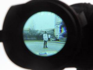 Police officer through a camera viewfinder