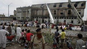 Firefighters and onlookers at the scene of the blaze