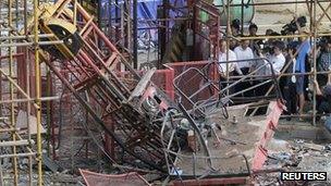 Hubei province government officials inspecting a collapsed lift 13 September 2012