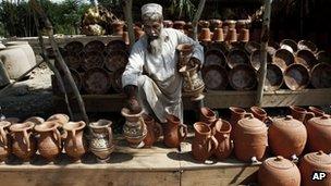 Man sells pottery in Laghman province