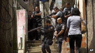 Police surround a house in Rocinha