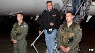 US Secretary of Defence Leon Panetta (centre) disembarks from his aircraft after arriving to Japan. Photo: 16 September 2012