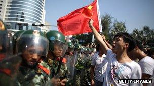 Anti-Japanese protesters confronted by police in Shenzhen, southern China, as they demonstrate over the disputed East China Sea islands, 16 Sept 2012