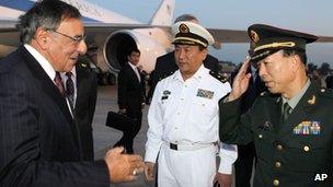 US Secretary of Defence Leon Panetta (L) is welcomed by Chinese military leaders after his arrival in Beijing (17 September)