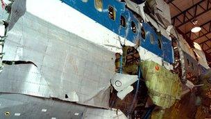 Jumbo jet fuselage showing bomb damage