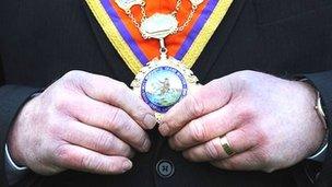 Orangemen holding his sash generic