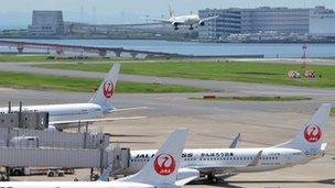 Japan Airlines jets are parked at Tokyo's Haneda airport