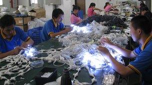 Workers at the Neo Neon factory, China