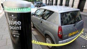 Electric car being charged in central London