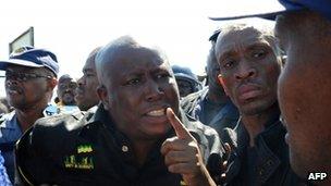 Julius Malema surrounded by police officers on 17 September 2012