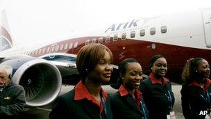 Air stewards stand outside an Arik Air plane in Seattle, US April 2007