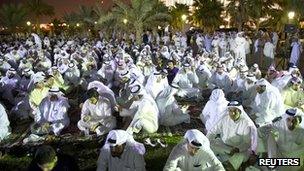 Thousands of opposition supporters protest outside parliament in Kuwait City (24 September 2012)