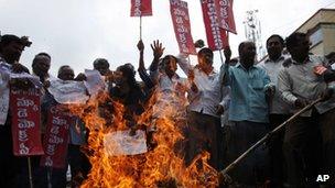 Protestors burn an effigy representing India"s ruling United Progressive Alliance during a nationwide strike in Hyderabad, India, Thursday, Sept. 20, 2012.