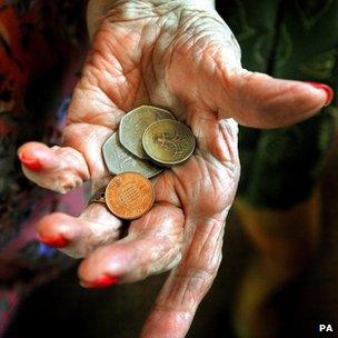 Elderly woman with money in her hand